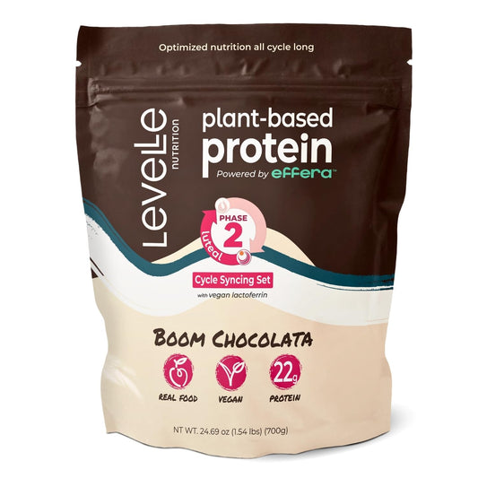 Levelle Boom Chocolata tub close-up shows rich plant-based protein powder texture for post-workout recovery.
