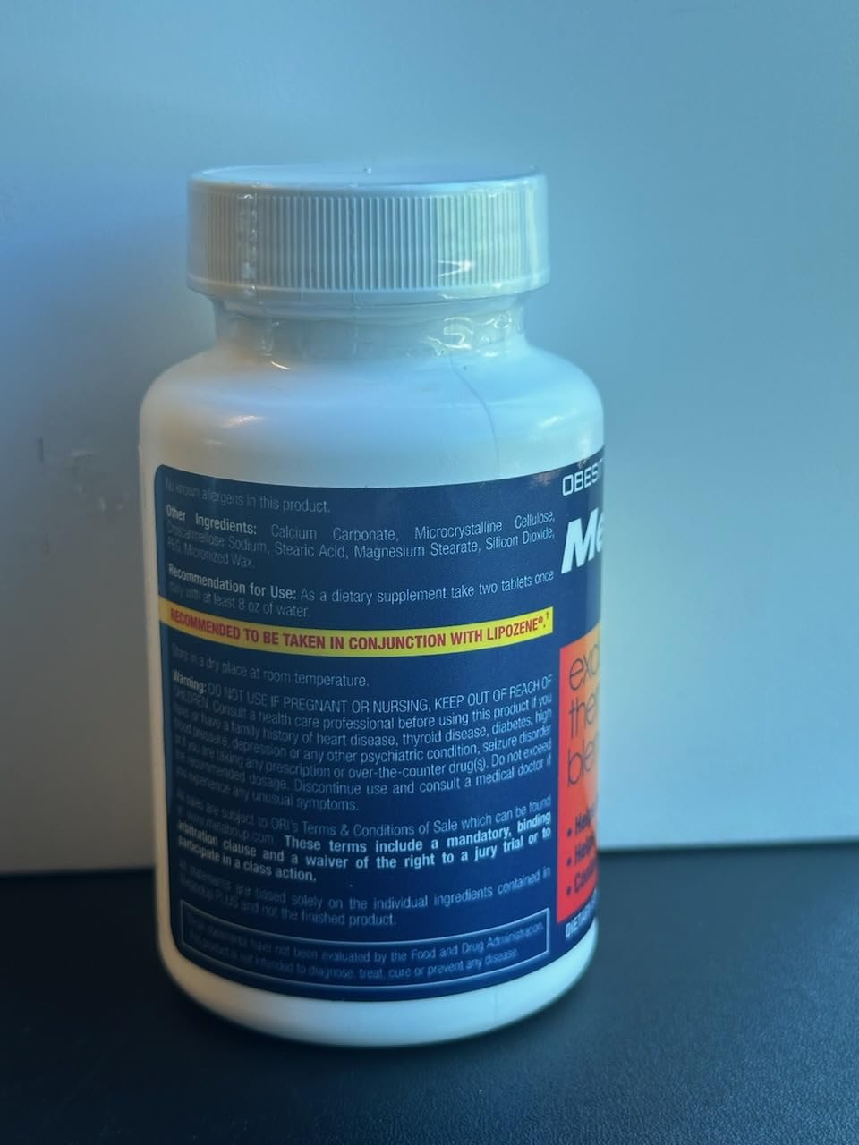Lipozene MetaboUP Plus brand logo closeup reinforces trust and recognition.