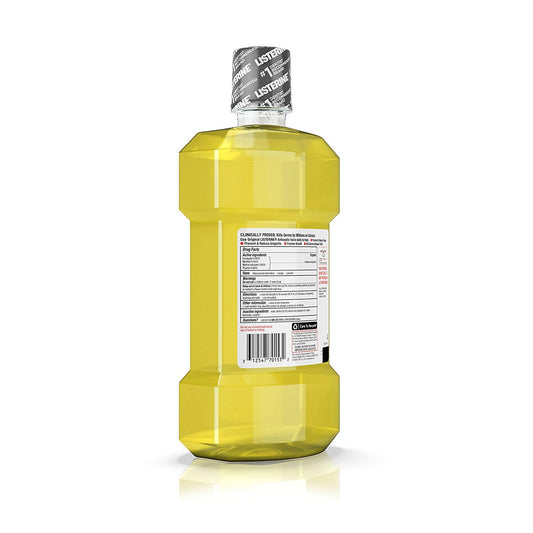 Pouring Listerine Original Intense mouthwash into a cup for daily rinse.