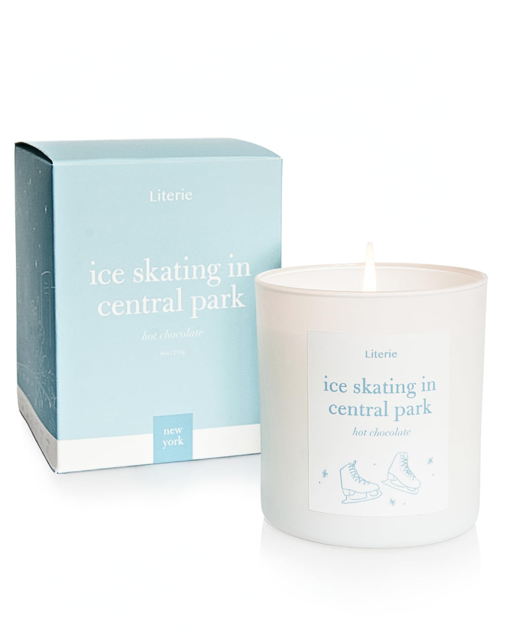 Literie NYC-inspired candle featuring ice skating Central Park scene for cozy ambiance.