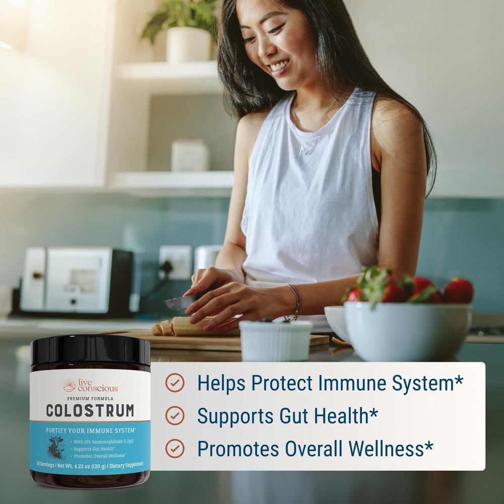 Live Conscious colostrum powder measuring spoon with clear dosage.