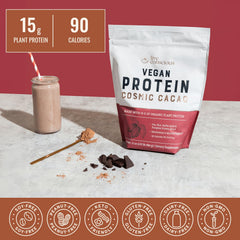 Live Conscious Cosmic Cacao serving spoon beside powder for quick, protein-rich smoothie prep.
