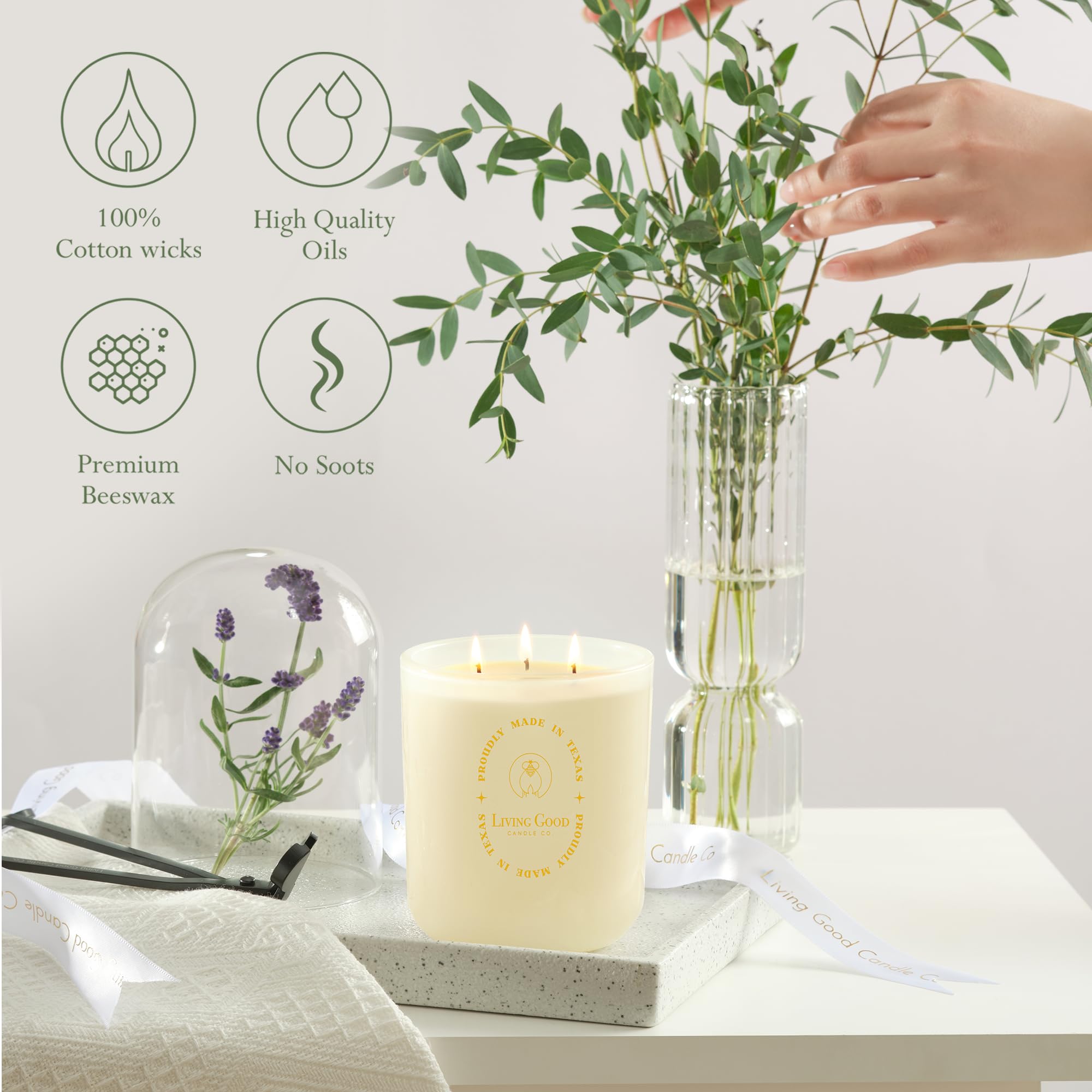 Living Good Claricomb candle lit on coffee table creates a cozy evening mood