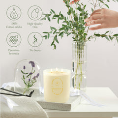 Living Good Claricomb candle lit on coffee table creates a cozy evening mood
