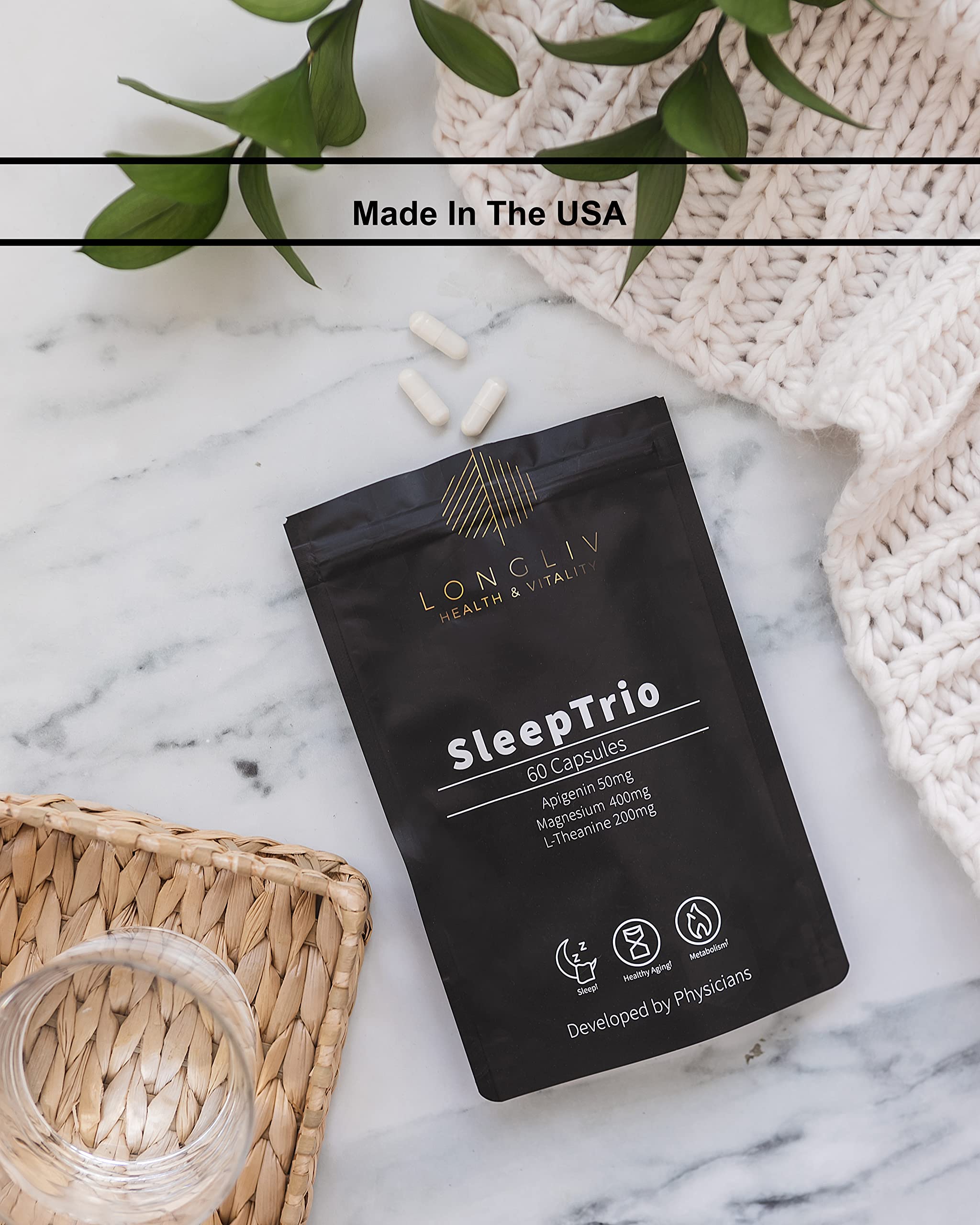 LongLiv Sleep Trio capsules arranged with water for bedtime routine.