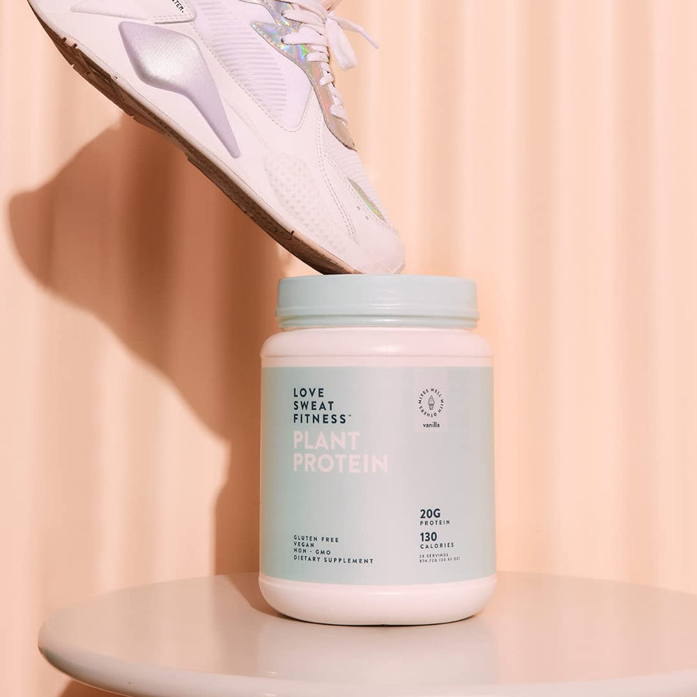 Love Sweat Fitness protein powder being poured into smoothie shows quick, convenient nourishment.