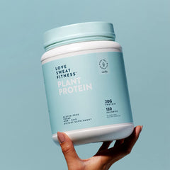 Love Sweat Fitness vanilla protein powder bag on counter suggests baking-friendly option.
