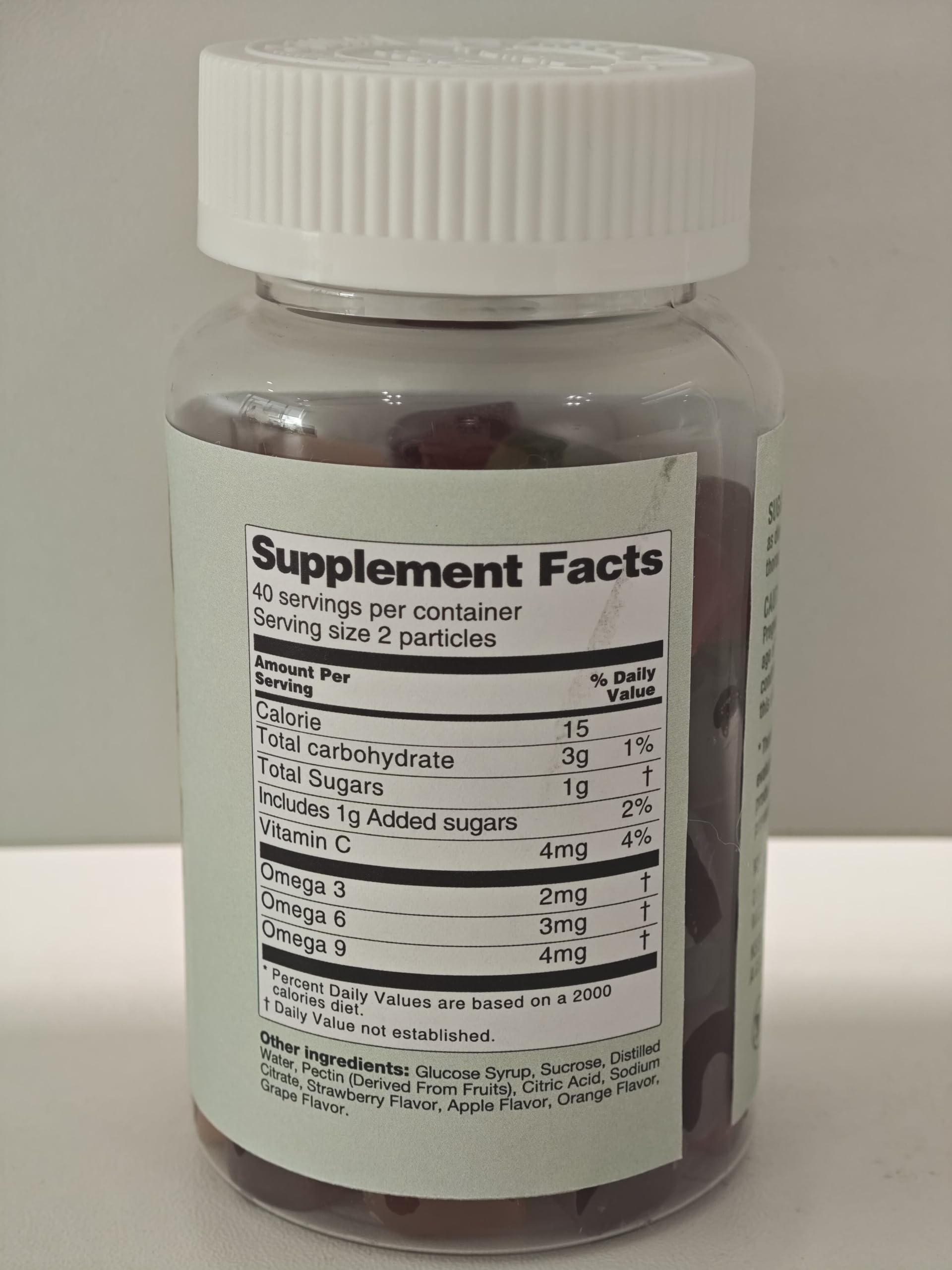 LUCKCHAN Omega Gummies bottle closeup showing all-natural flavors and smooth texture