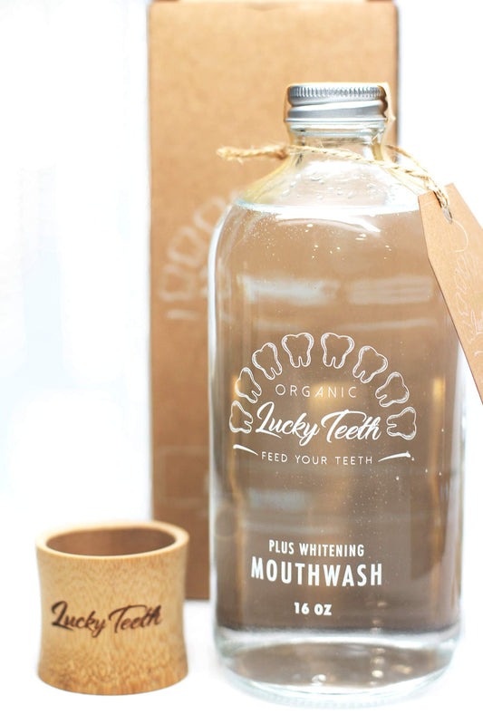 Lucky Teeth Organic Mouthwash bottle close-up showing glass jar and minty freshness