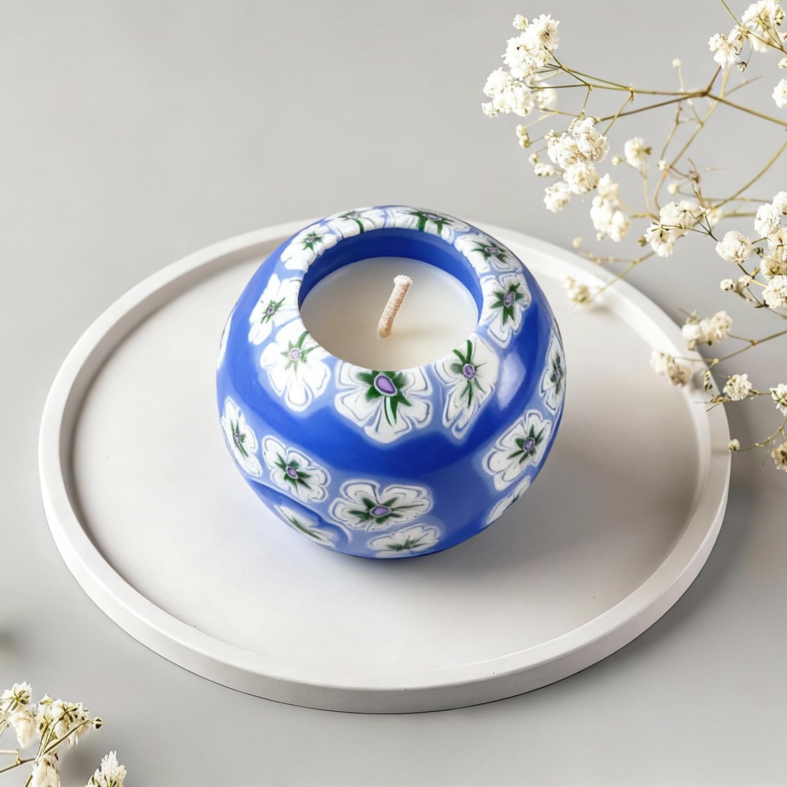 LumeTon Alan's Candle enhances living-room ambience with a warm glow.