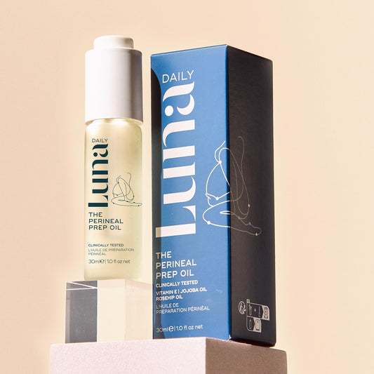 Luna Daily perineal massage oil application showing a gentle massage technique.