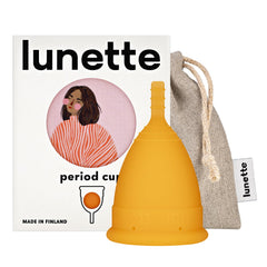 Lunette period cup orange size 2 in use for all-day leak protection.