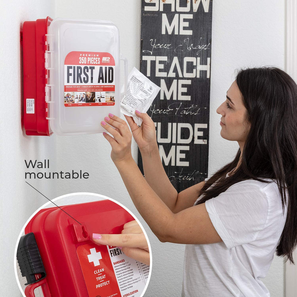 M2 BASICS first aid kit with dual-layer swing-out trays organizes supplies.