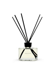 Maison Louis Marie No.13 Nouvelle Vague diffuser bottle reveals bright citrus and florals for a vibrant room.