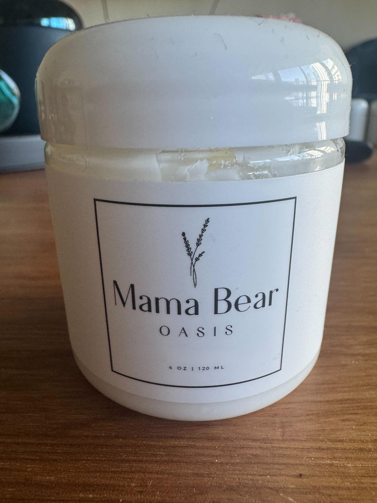 Mama Bear Oasis Lotion bottle closeup with lavender label for daily skin comfort.