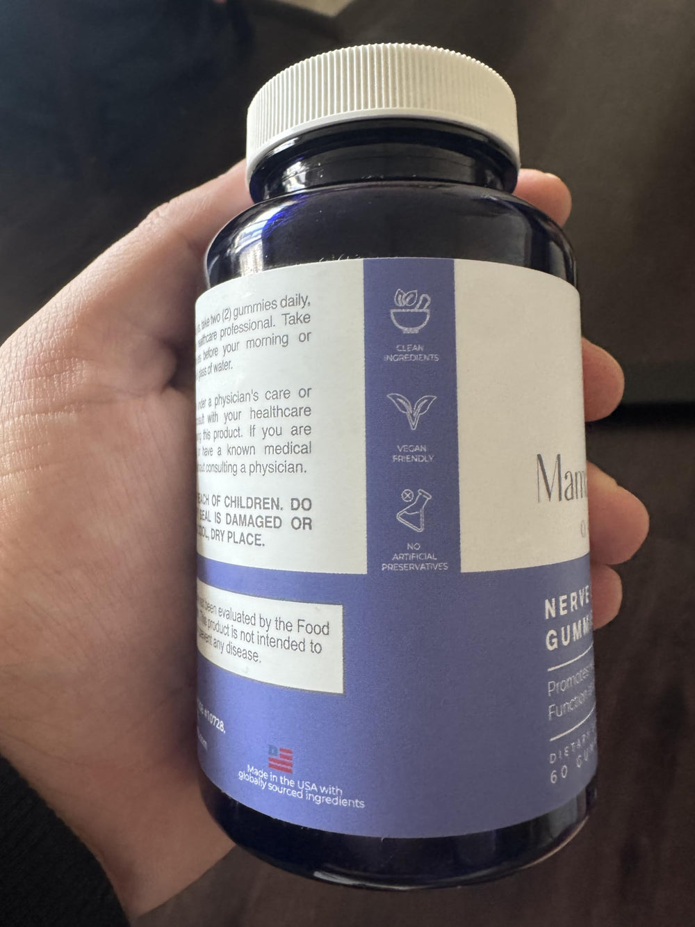 Mama Bear Oasis Nerve Support Gummies packaging shot emphasizing USA-made vegan formula.