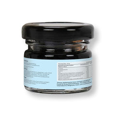 Dissolving Mars by GHC Shilajit Resin in warm milk for easy use