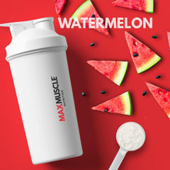Max Muscle Pro BCAA mixing in water glass for convenient pre or post-workout use.