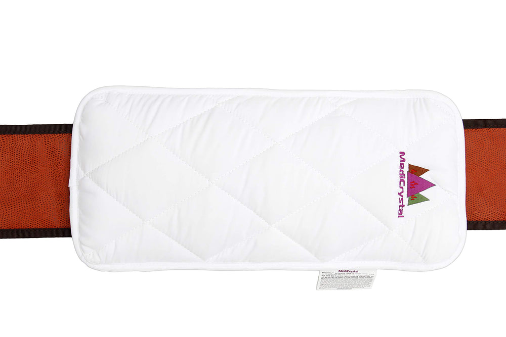 MediCrystal belt around the lower back illustrating warm comfort at home.