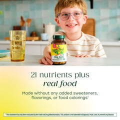 MegaFood Kids One Daily tablet in hand, easy to take on the go.