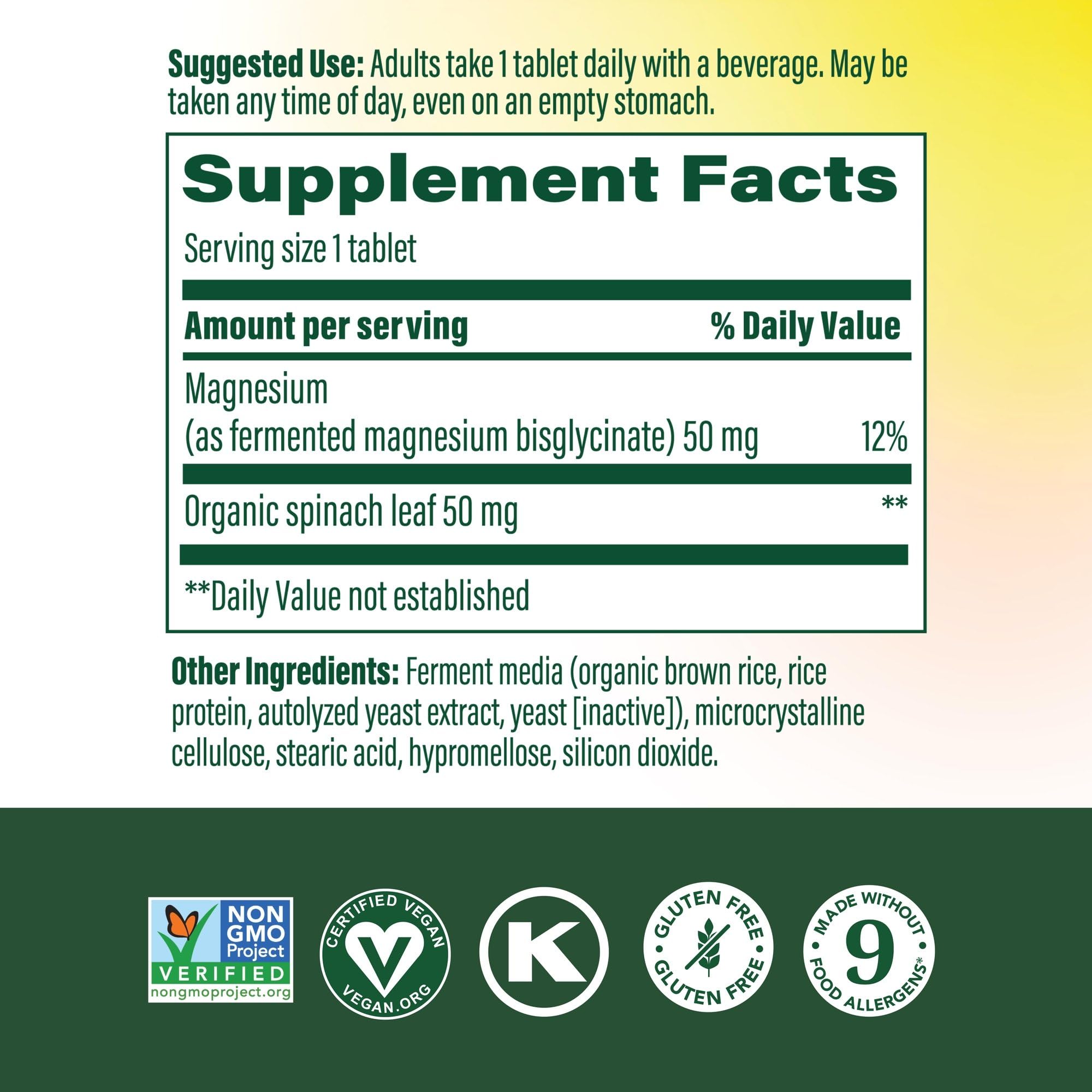 MegaFood Magnesium supplement tablet closeup highlights chelated magnesium glycinate.