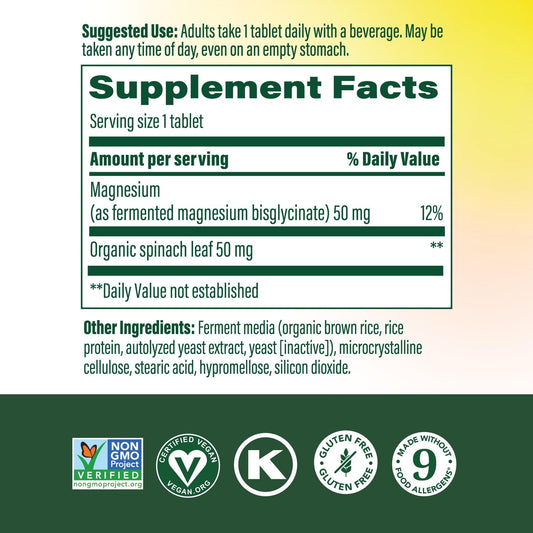 MegaFood Magnesium supplement tablet closeup highlights chelated magnesium glycinate.