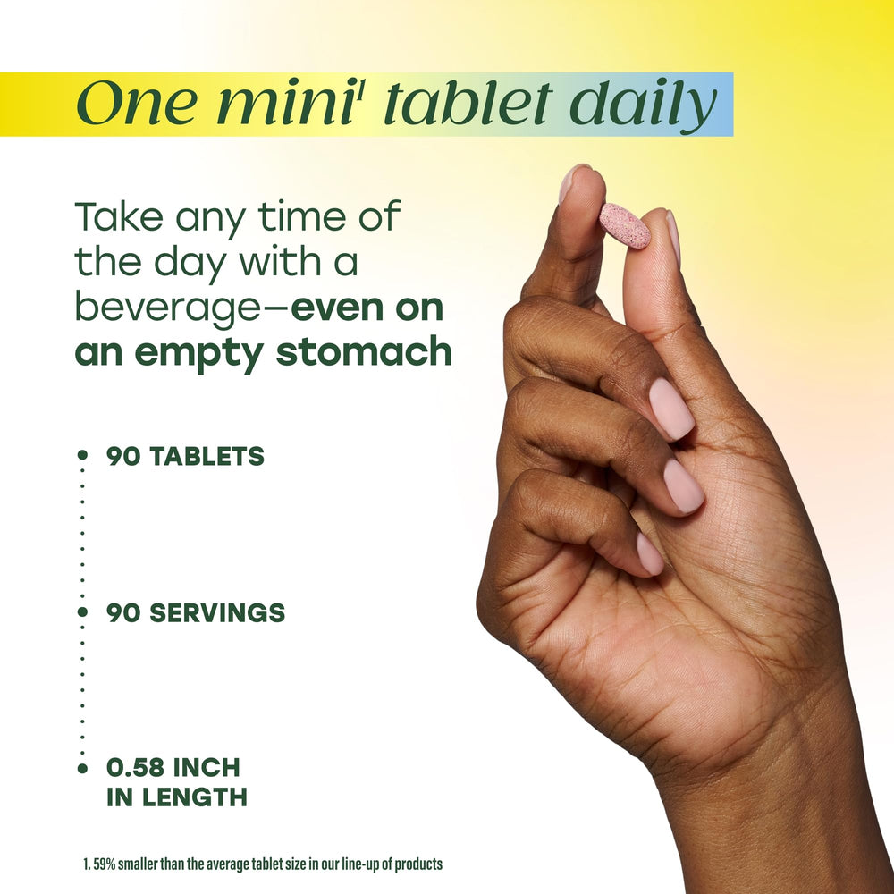 Hand holding MegaFood Methyl B12 tablet for daily routine