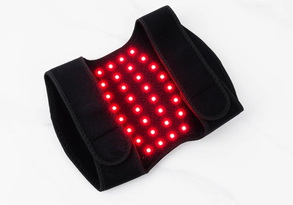 Megelin red light knee pad in office setup shows compact design for quick sessions.