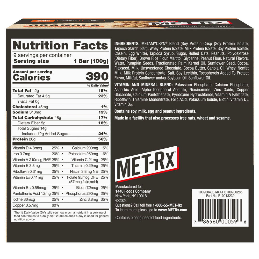 MET-Rx Big 100 bar bite showing chewy granola and chips.