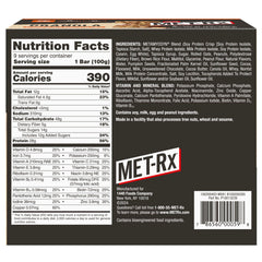 MET-Rx Big 100 bar bite showing chewy granola and chips.