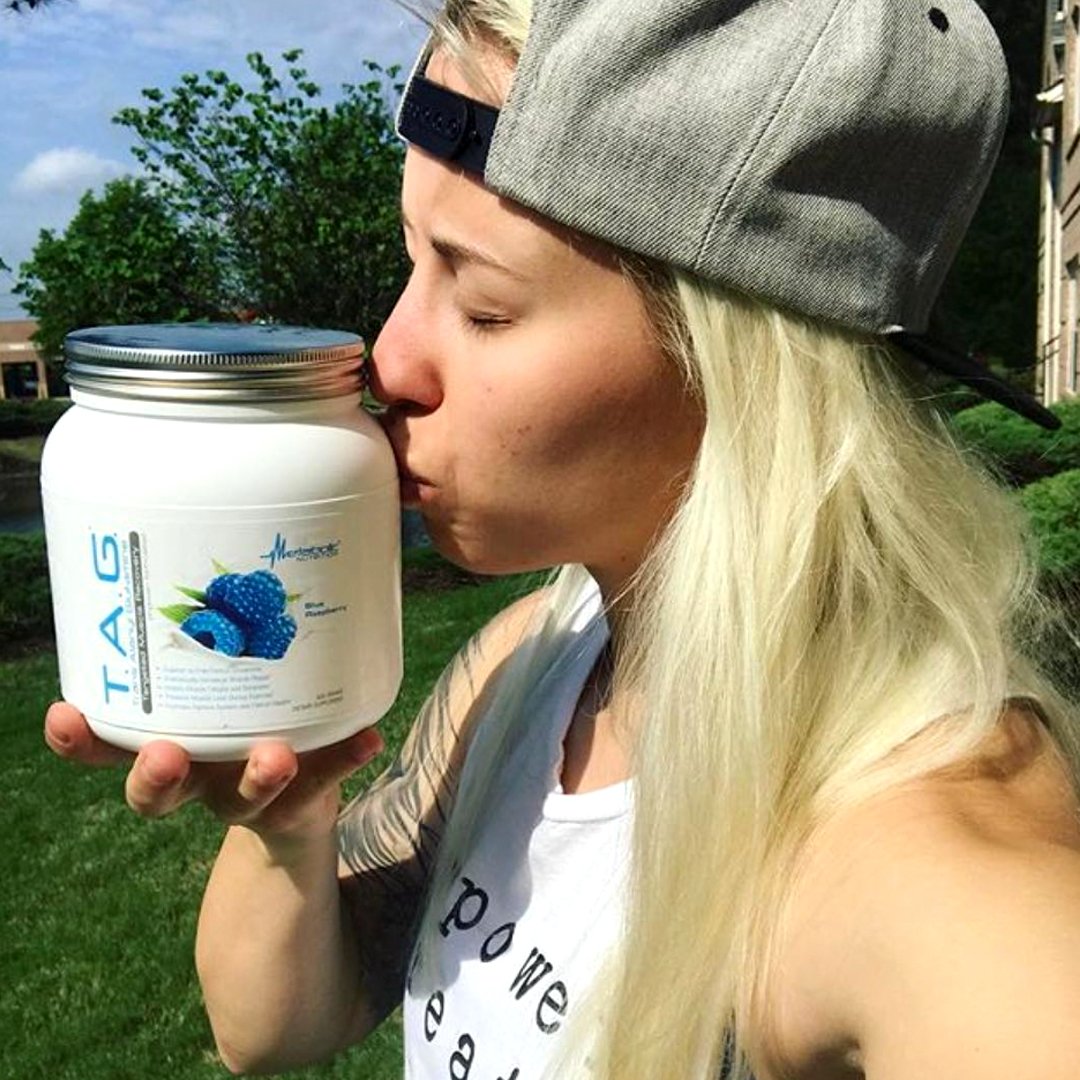 Metabolic Nutrition TAG powder in glass for quick intra-workout sip.