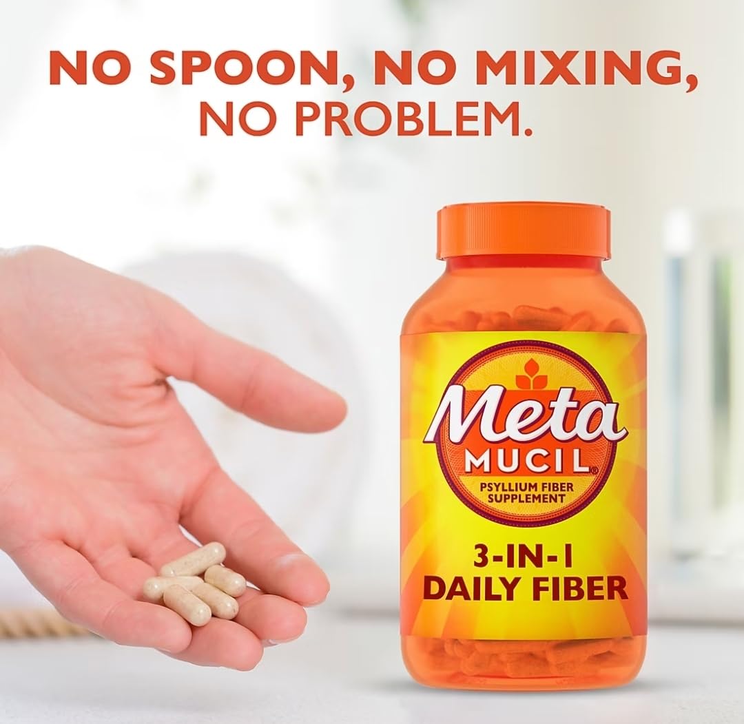 Metamucil capsules on kitchen counter with water for easy daily use.