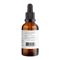 Midwife Made Naturals postpartum balance drops beside glass of water for easy dosing.