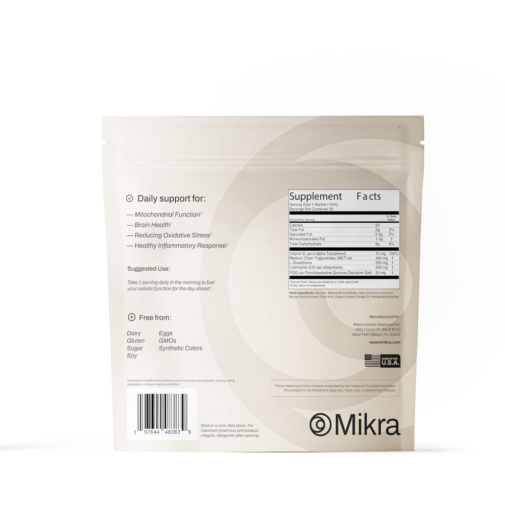 Mikra vial beside water for daily hydration.