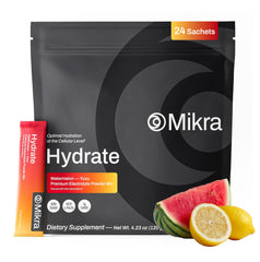 Mikra Hydrate Lemon Lime packet dissolving in a cup for quick hydration