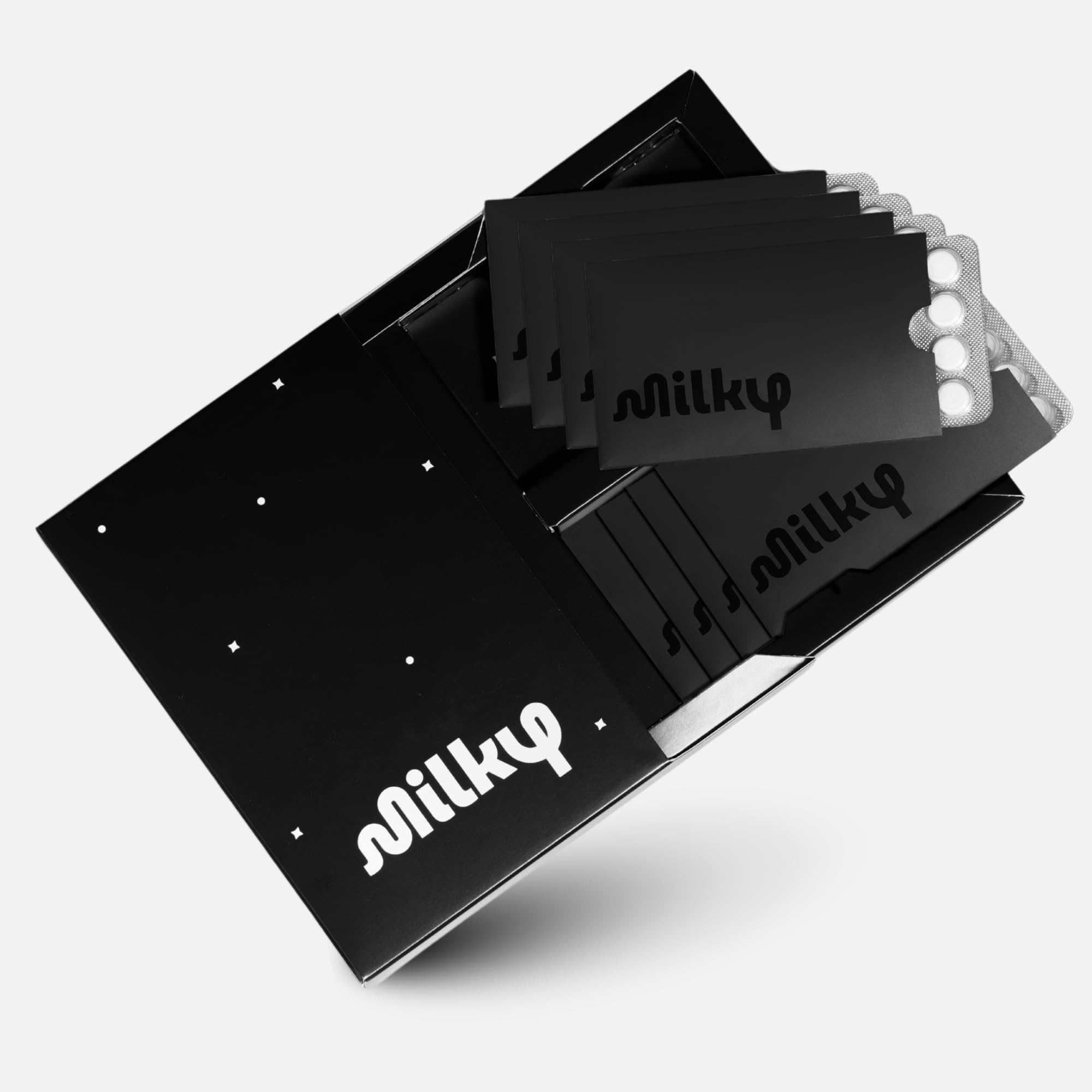 Milky lactose pills with sleeve packaging for discreet on-the-go dairy support.
