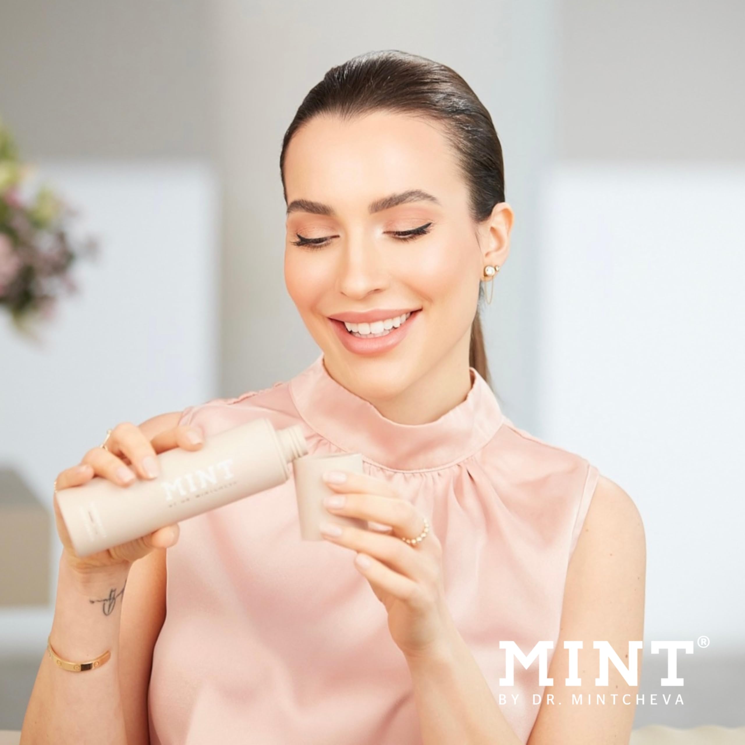 Mint Biotic Mouthwash pouring into glass promotes fresh breath rituals.