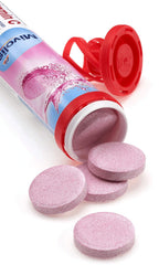 Mivolis effervescent tablets dissolving in water with citrus fizz