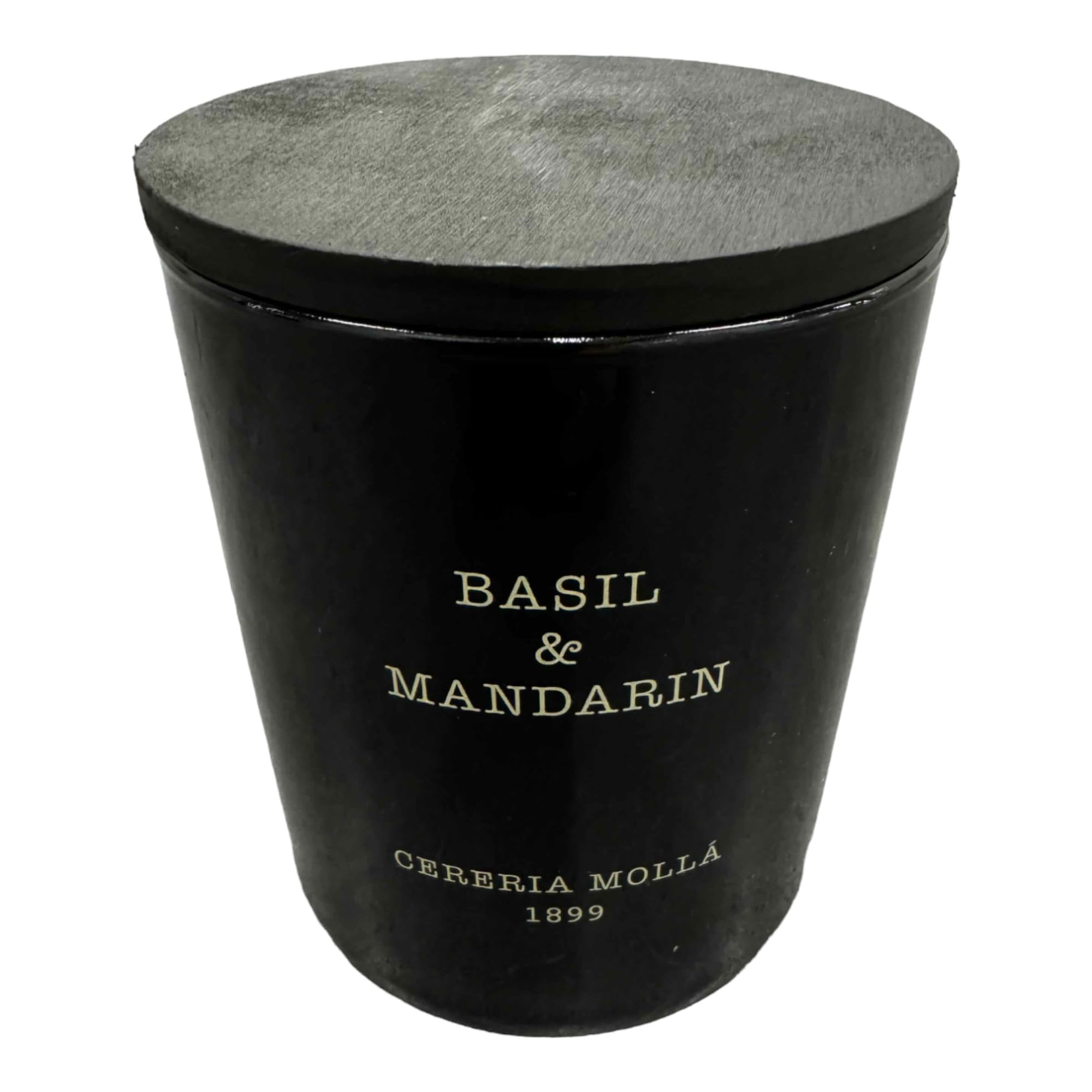 Molla 1899 handmade basil-mandarin candle in a jar offers a fresh, spring-like fragrance.