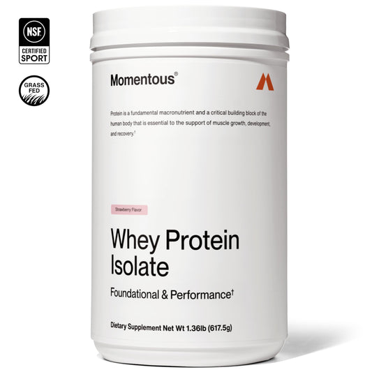 Momentous Essential Grass-Fed Whey scoop beside bottle for convenient daily protein