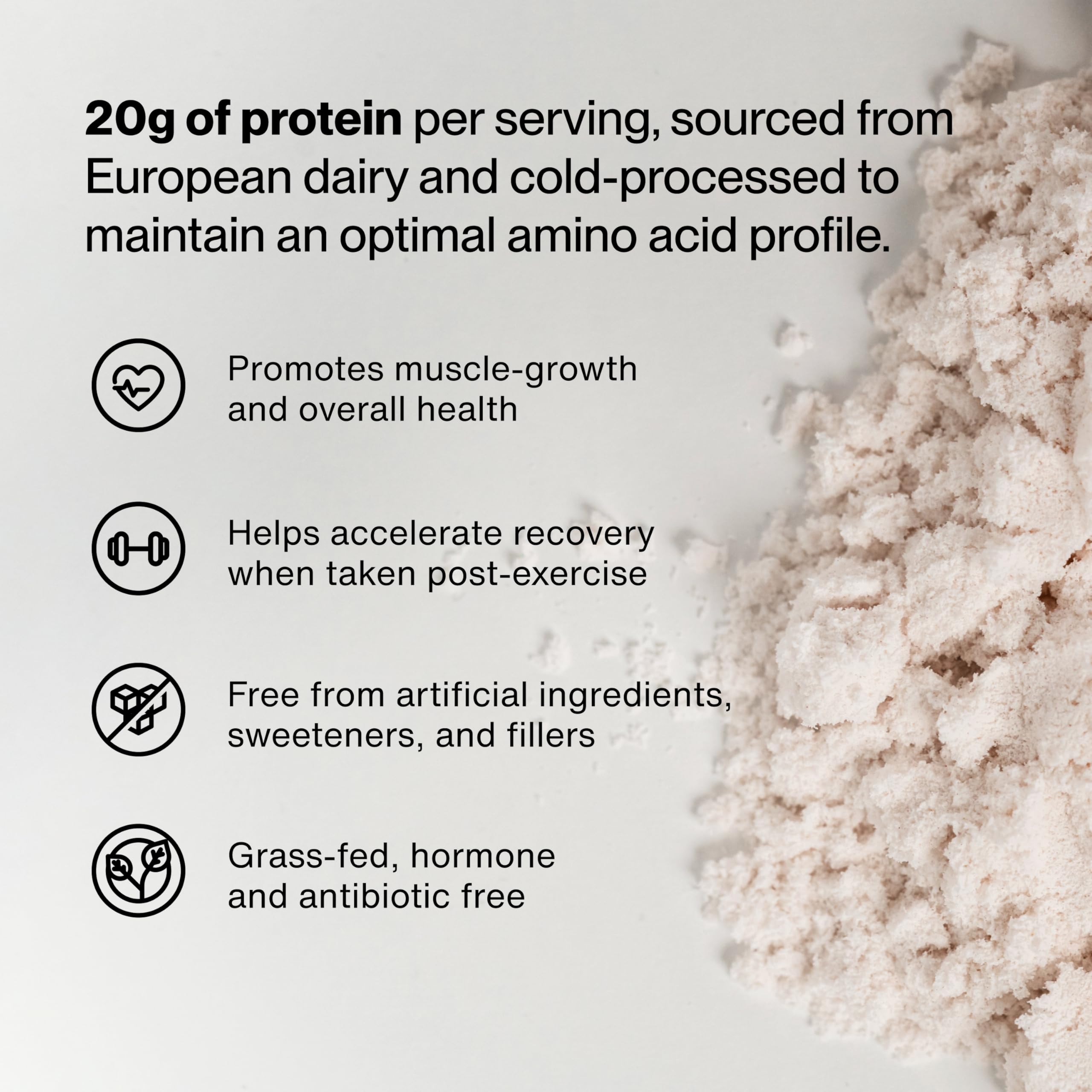 Momentous Essential Grass-Fed Whey shake in glass showing strawberry blend
