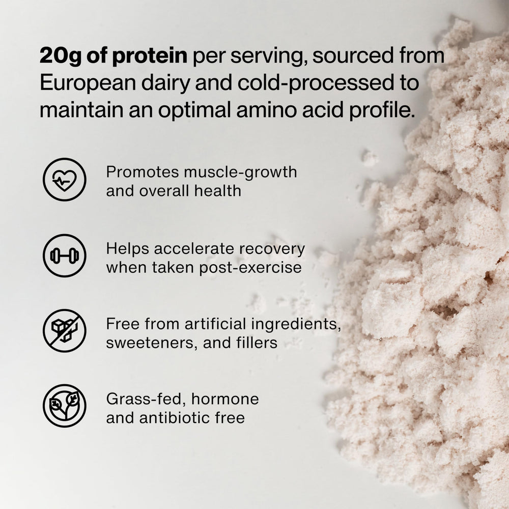 Momentous Essential Grass-Fed Whey shake in glass showing strawberry blend