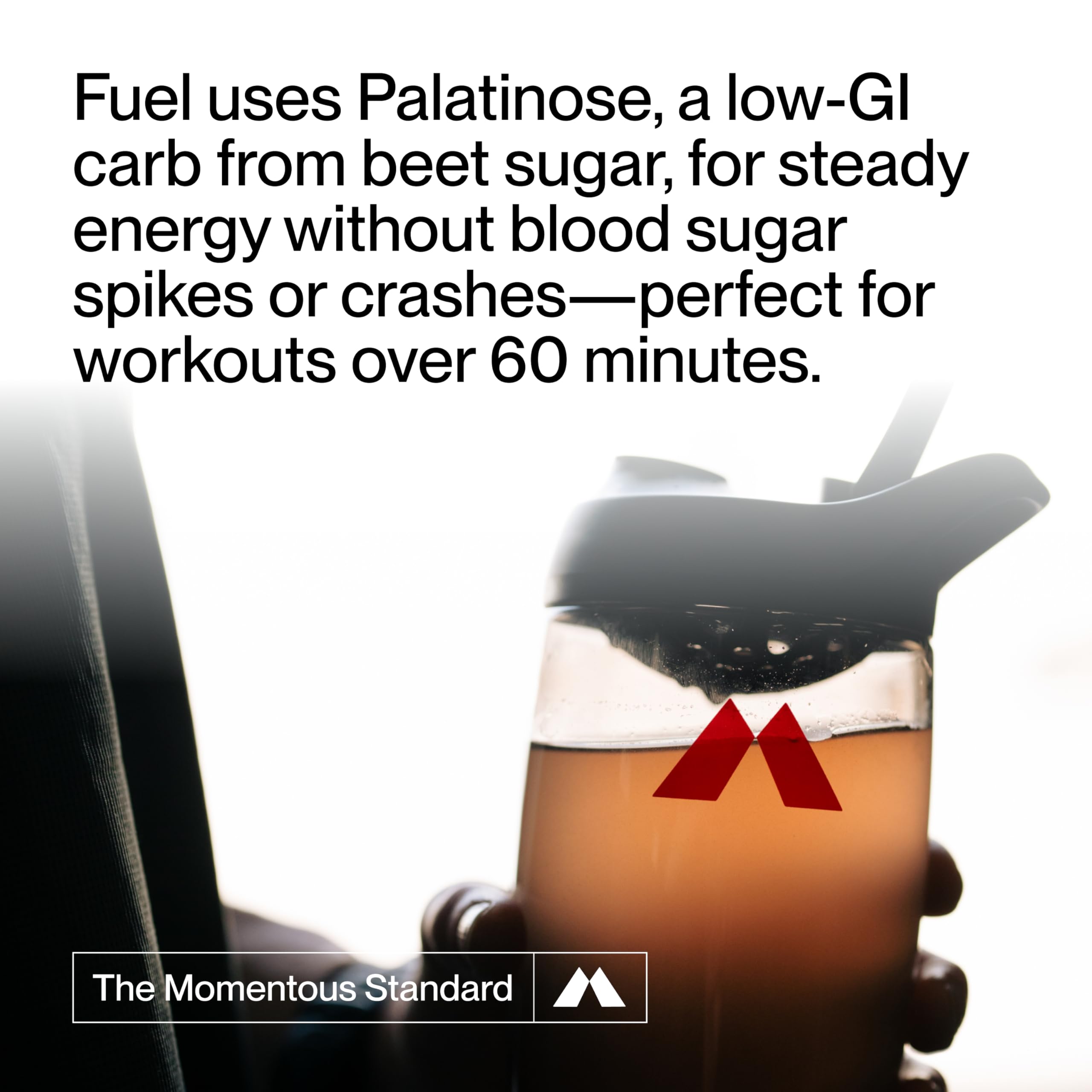 Athlete drinks Momentous Fuel from a bottle for sustained performance.