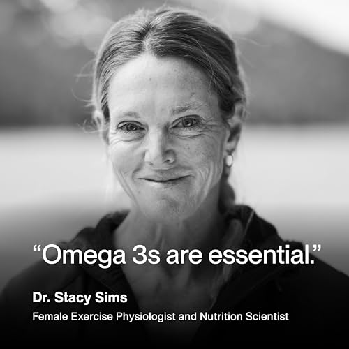 Momentous Omega-3 daily-use context with a person taking capsules