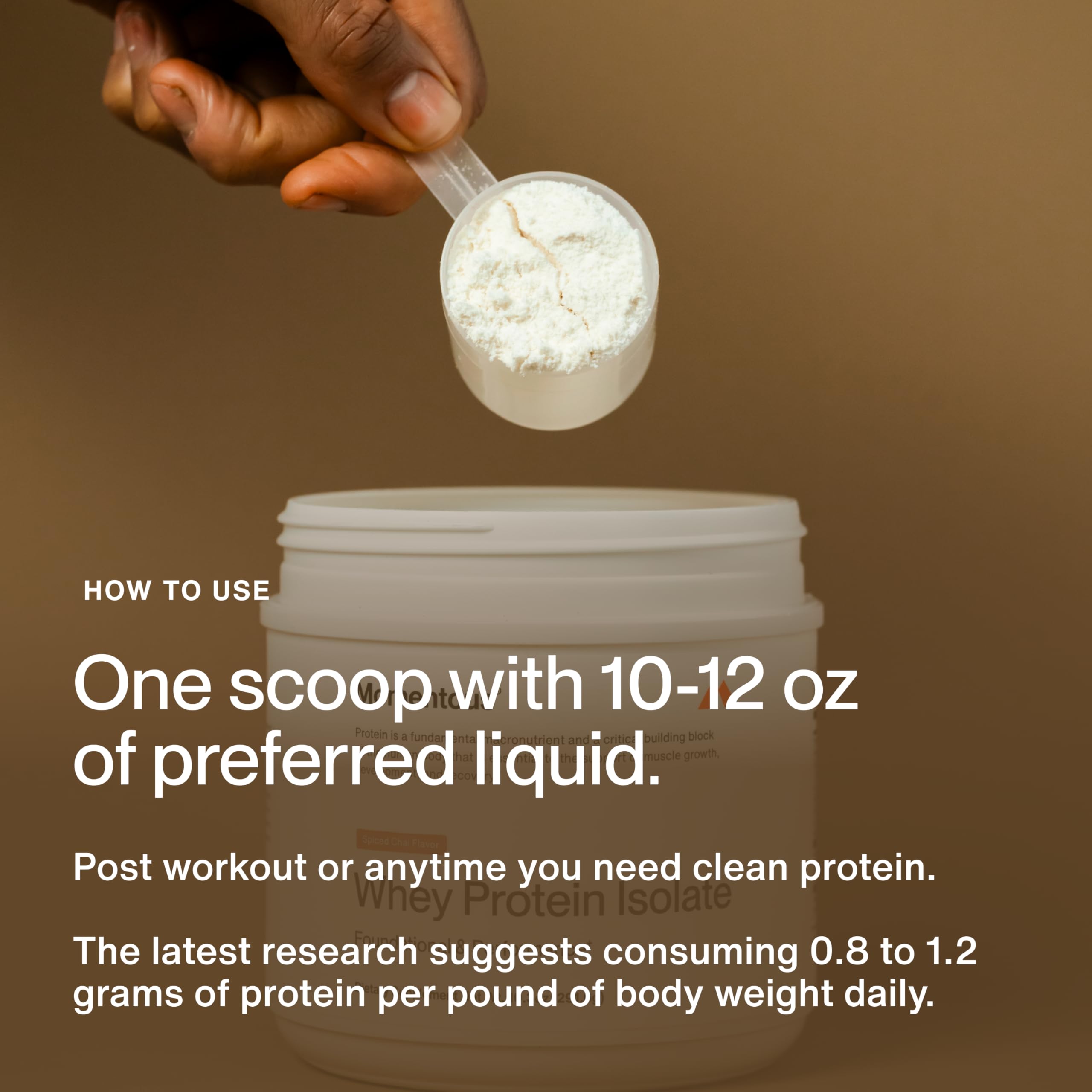 Momentous Spiced Chai whey powder in a glass with milk for a creamy shake.
