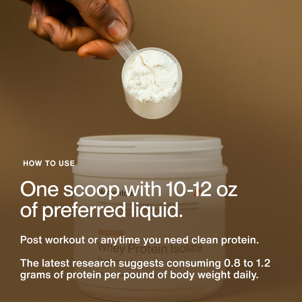 Momentous Spiced Chai whey powder in a glass with milk for a creamy shake.