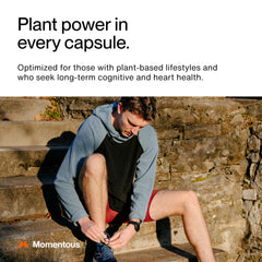 Momentous Vegan Omega-3 two capsules serving beside a healthy meal.