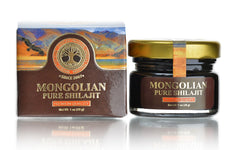 Authentic Mongolian Shilajit bottle in the Altai mountains for natural daily vitality.