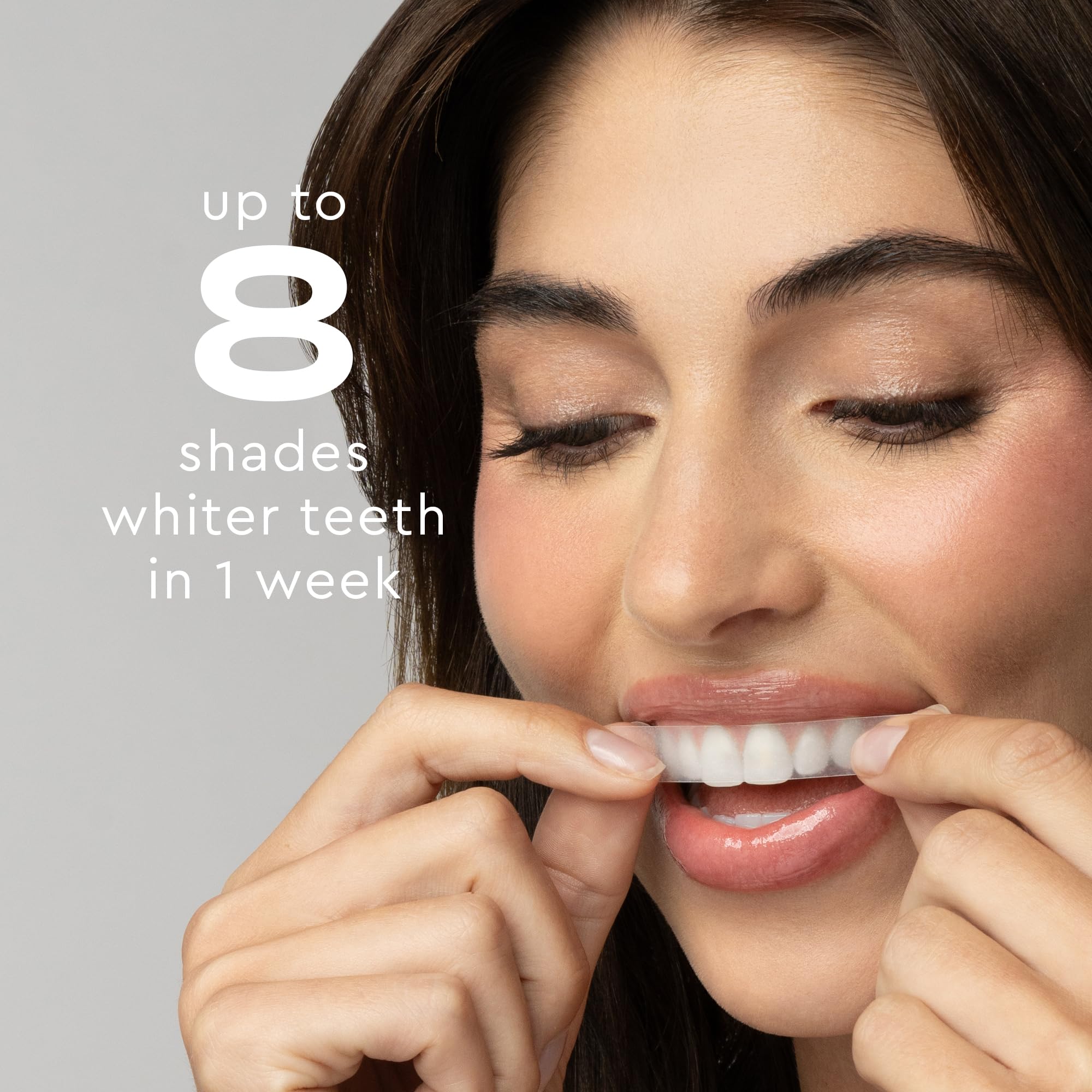 MOON strips applied to teeth demonstrating precise no-rinse adhesion