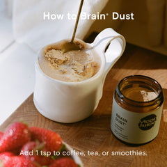 Moon Juice Brain Dust tea-cup spotlight hints at versatile usage in beverages and routines.